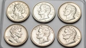 Collection of shiny, uncirculated coins in mint sets.